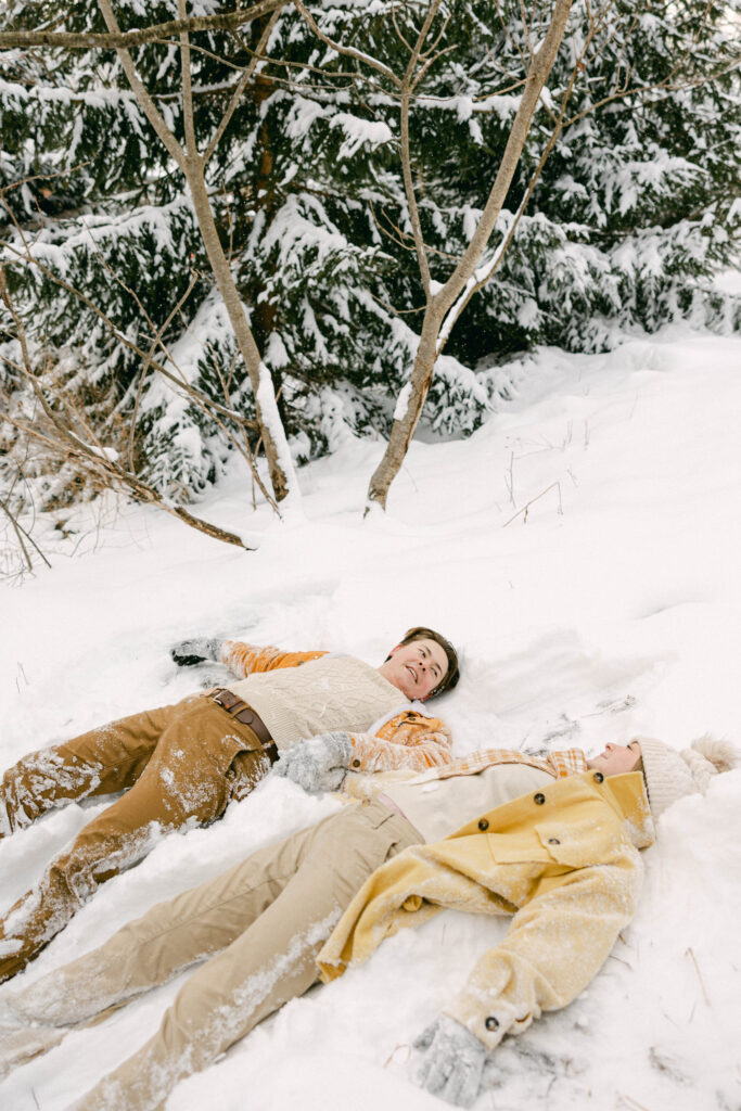 playful engagement session in the snow
